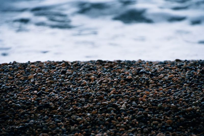 Close-up view of the pebble beach at Burton Bradstock, ideal for coastal and nature themes.