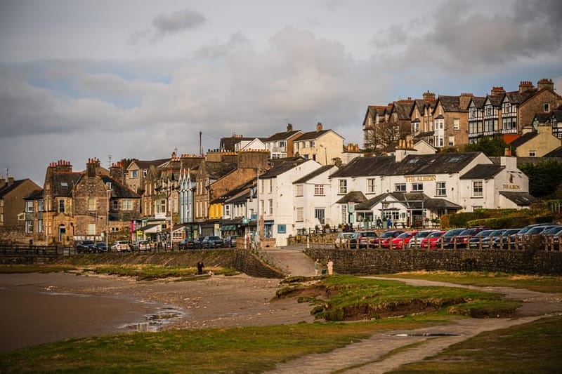 Picturesque view of Arnside village with historic buildings by the seaside, Cumbria, UK.