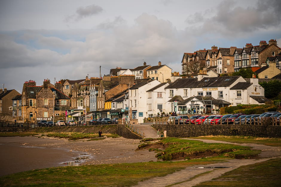 Picturesque view of Arnside village with historic buildings by the seaside, Cumbria, UK.